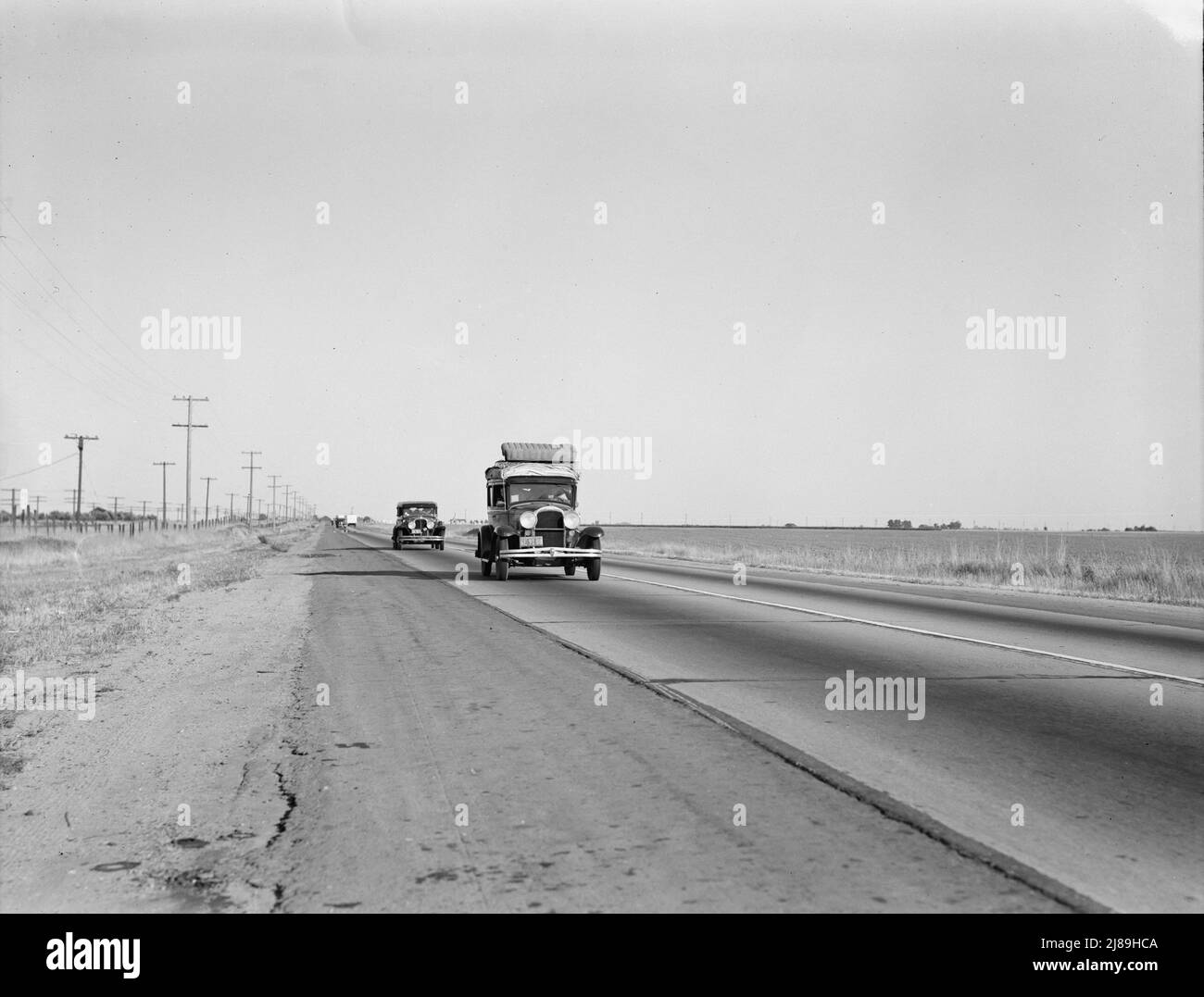 Between Tulare and Fresno. Migrants on the road. California. Stock Photo