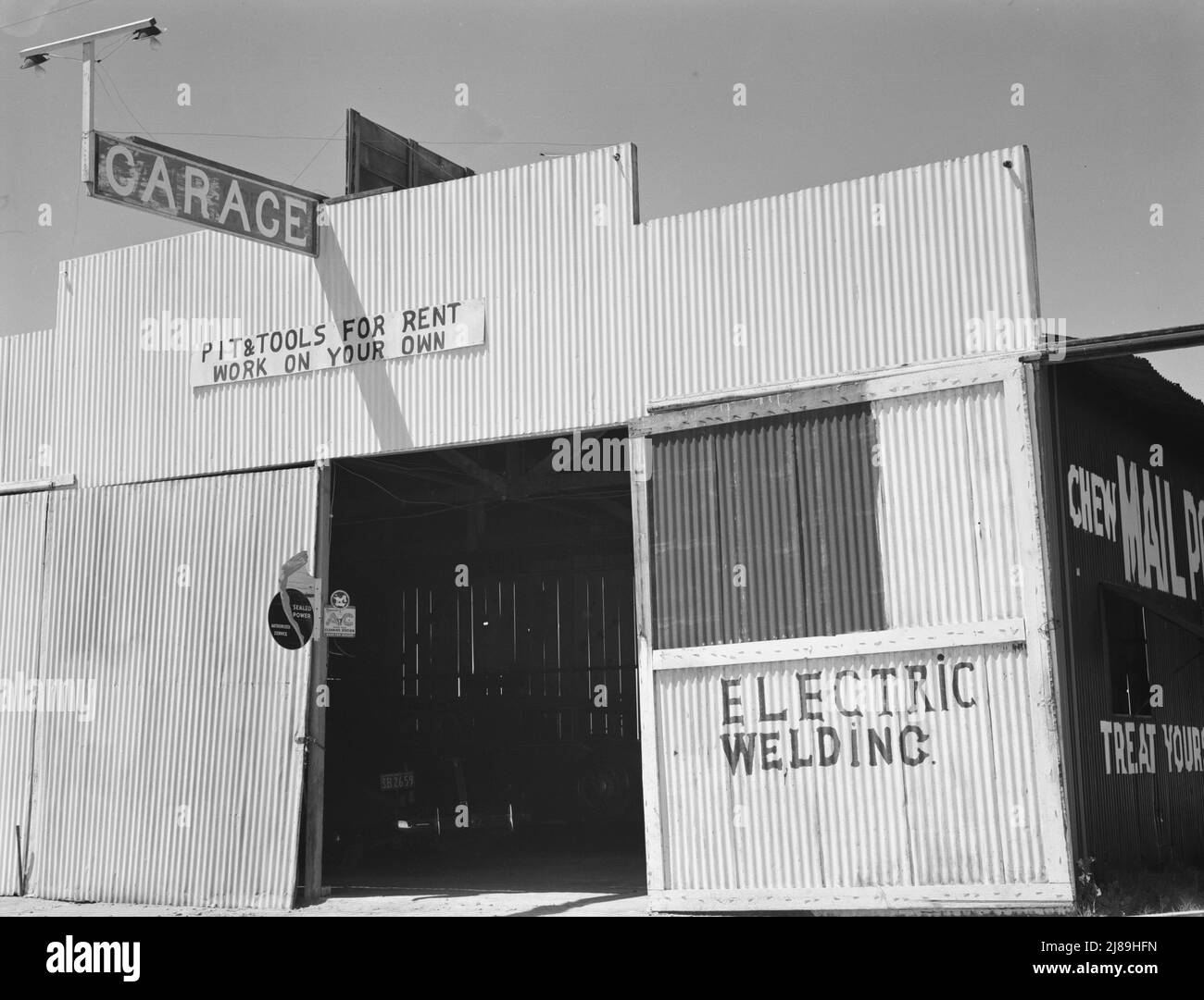 U.S. 99. Fresno County. &quot;Pit and tools for rent--work on your own.&quot; California. ['Garage; Electric Welding']. Stock Photo