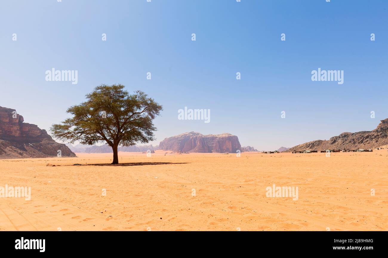 Wadi Rum in southern Jordan. It is located about 60 km to the east of Aqaba. Wadi Rum has led to its designation as a UNESCO World Heritage Site and i Stock Photo