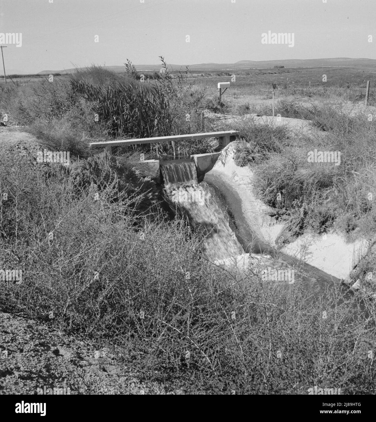 Irrigation ditch, showing drop in canal. Dead Ox Flat, Malheur County, Oregon. Stock Photo
