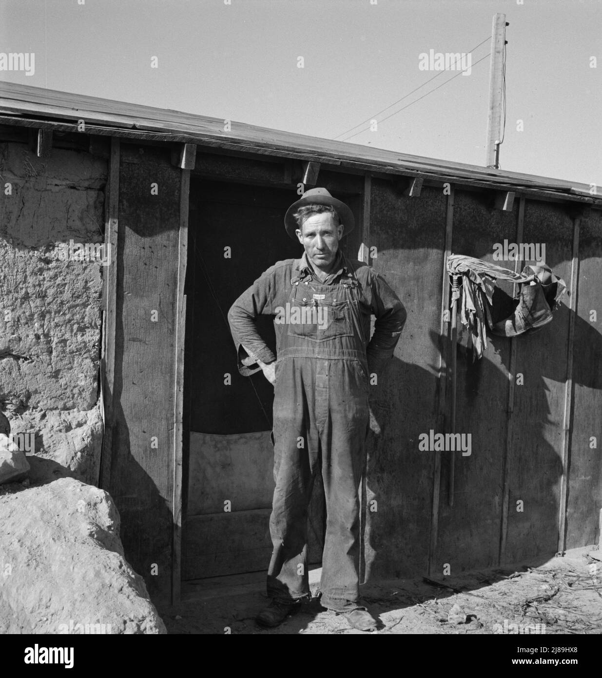 Mr. Roberts in front of his Owyhee project home. Malheur County, Oregon. Stock Photo