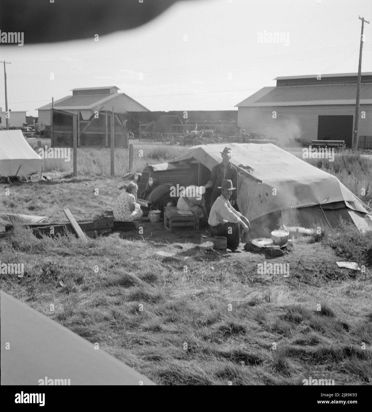 Living conditions for migrant potato pickers. Note potato sheds across the road. Siskiyou County, California. Stock Photo