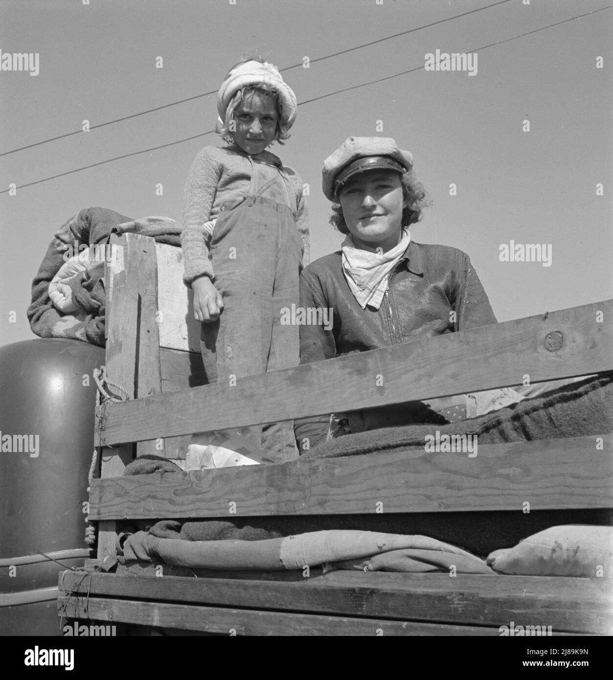 Part of family come for work in potatoes. Tulelake, Siskiyou County, California. Left their home in Turkey, Texas, November, 1938. Picked cotton in Arizona till March. Picked fruit in Oregon till June. Picked prunes in Idaho till September 15th. Stock Photo