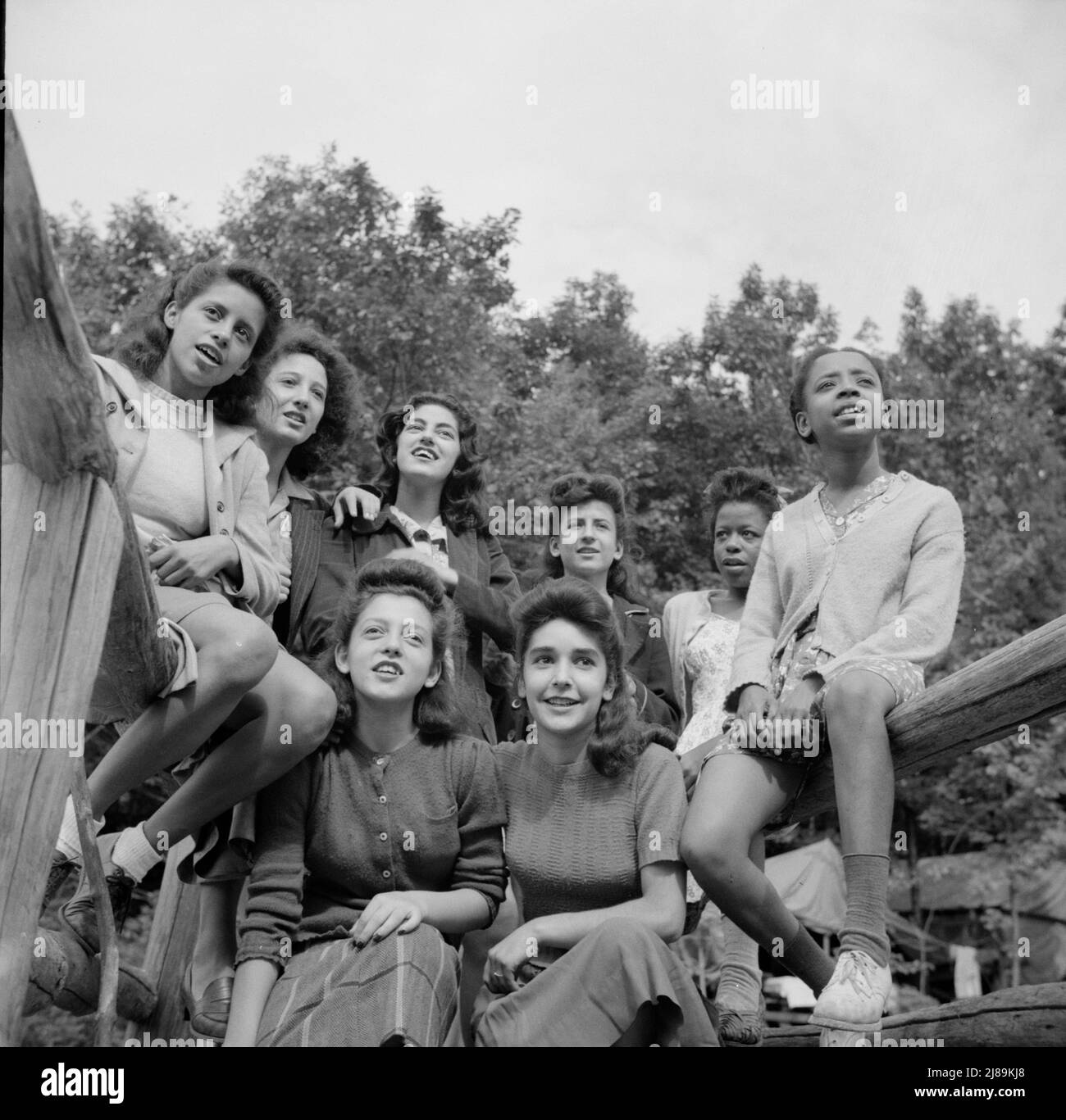 Arden, New York. Interracial activities at Camp Gaylord White, where children are aided by the Methodist Camp Service. Campers singing the &quot;Ballad for Americans&quot;. Stock Photo