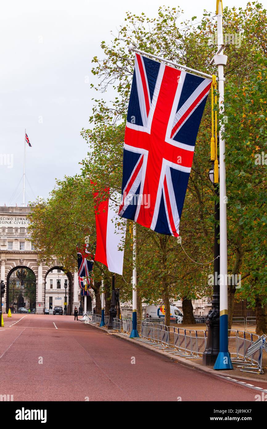 LONDON, UK - OCTOBER 28, 2012: Flying Union Jack flags decorating the Mall, the landmark ceremonial approach road to Buckingham Palace Stock Photo