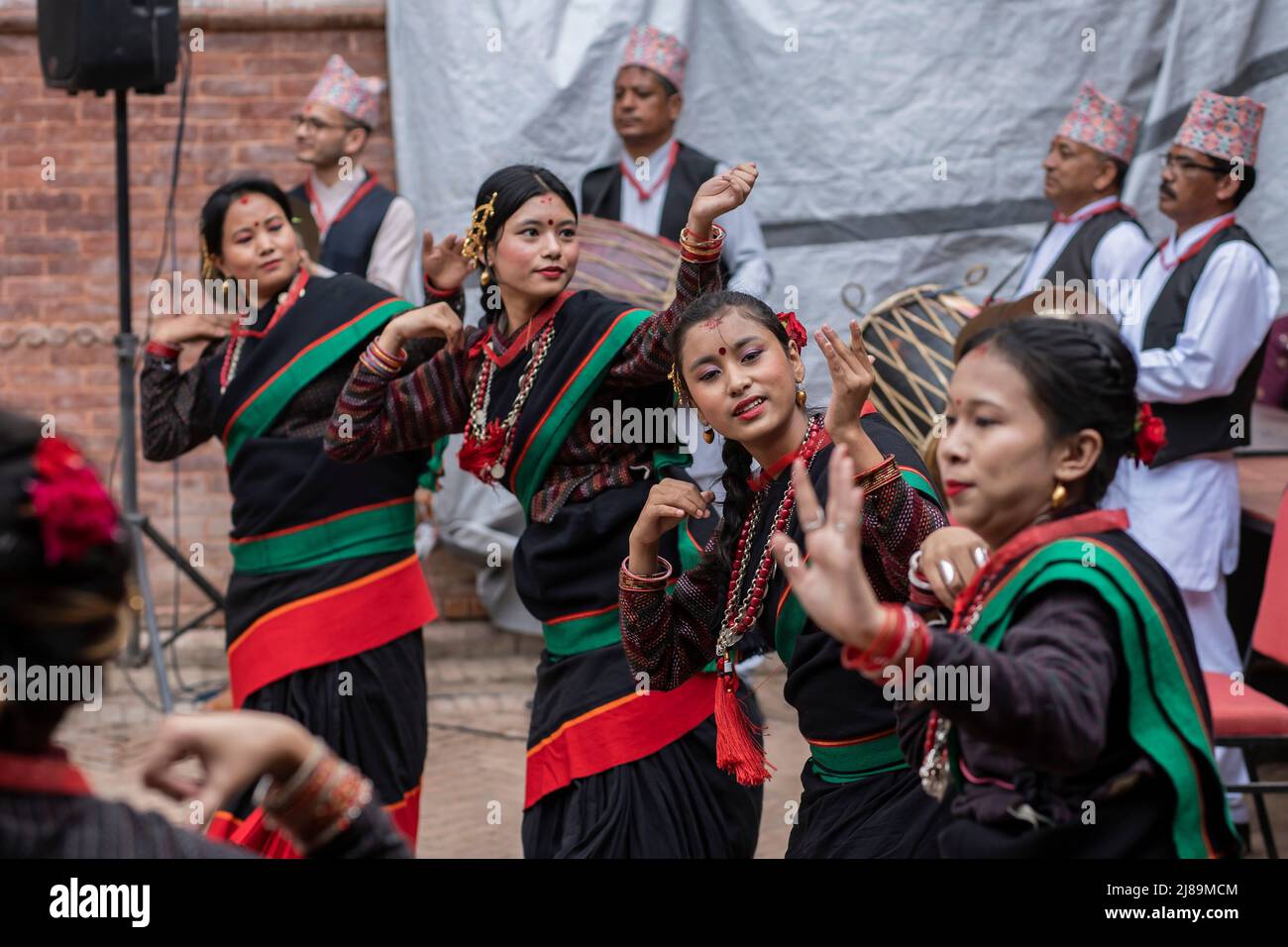 Lalitpur, Nepal. 14th May, 2022. Newar women perform a traditional drum dance during a culture show in Lalitpur, Nepal, May 14, 2022. Credit: Hari Maharjan/Xinhua/Alamy Live News Stock Photo