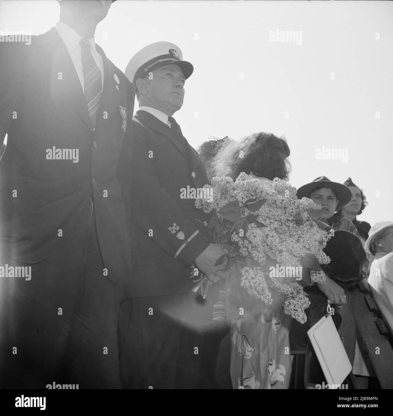[Untitled photo, possibly related to: Gloucester, Massachusetts. Memorial Day, 1943. Girl scouts attending the Memorial services]. Stock Photo