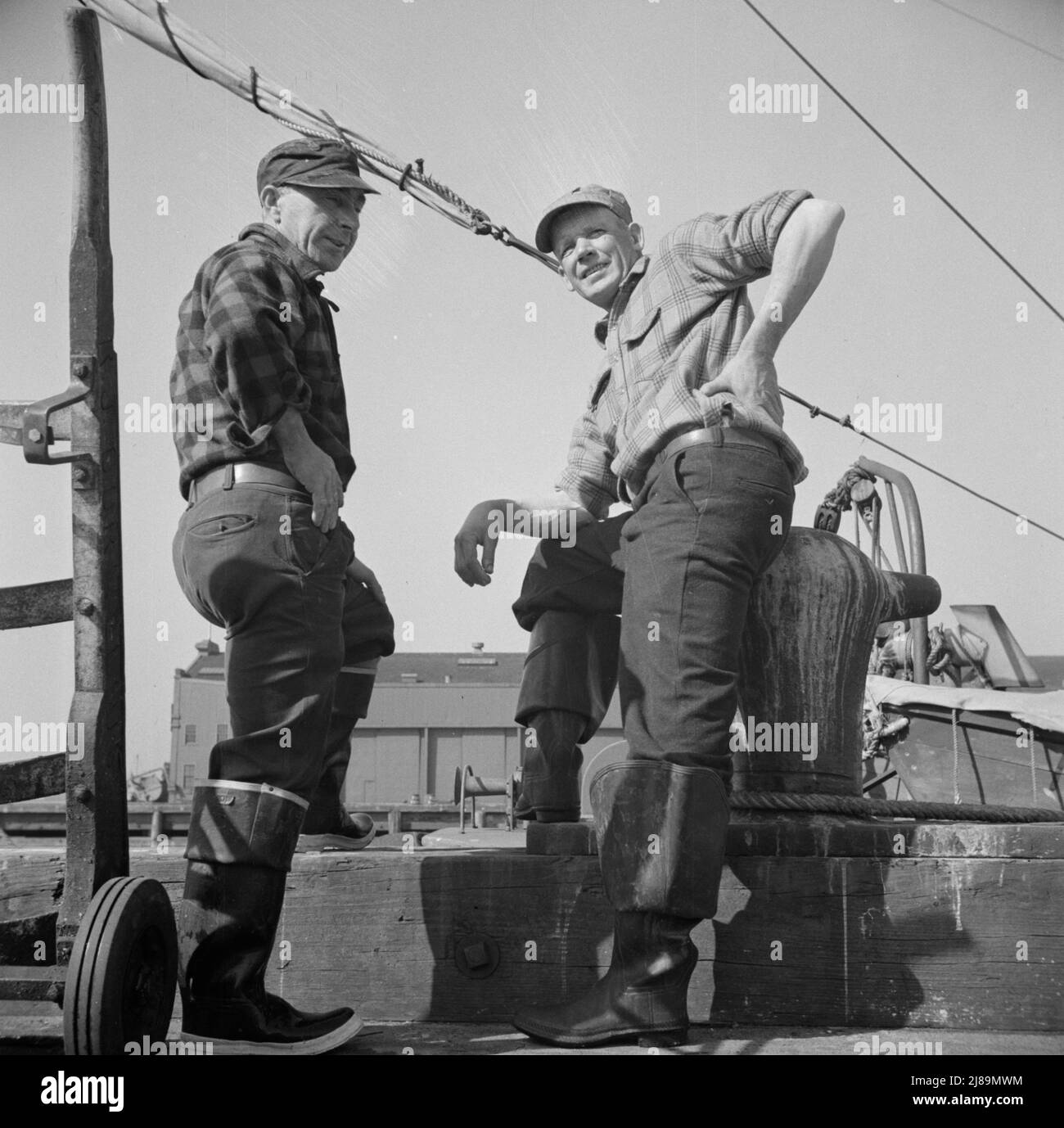 New York, New York. New England fishermen resting on the Fulton docks. Stock Photo