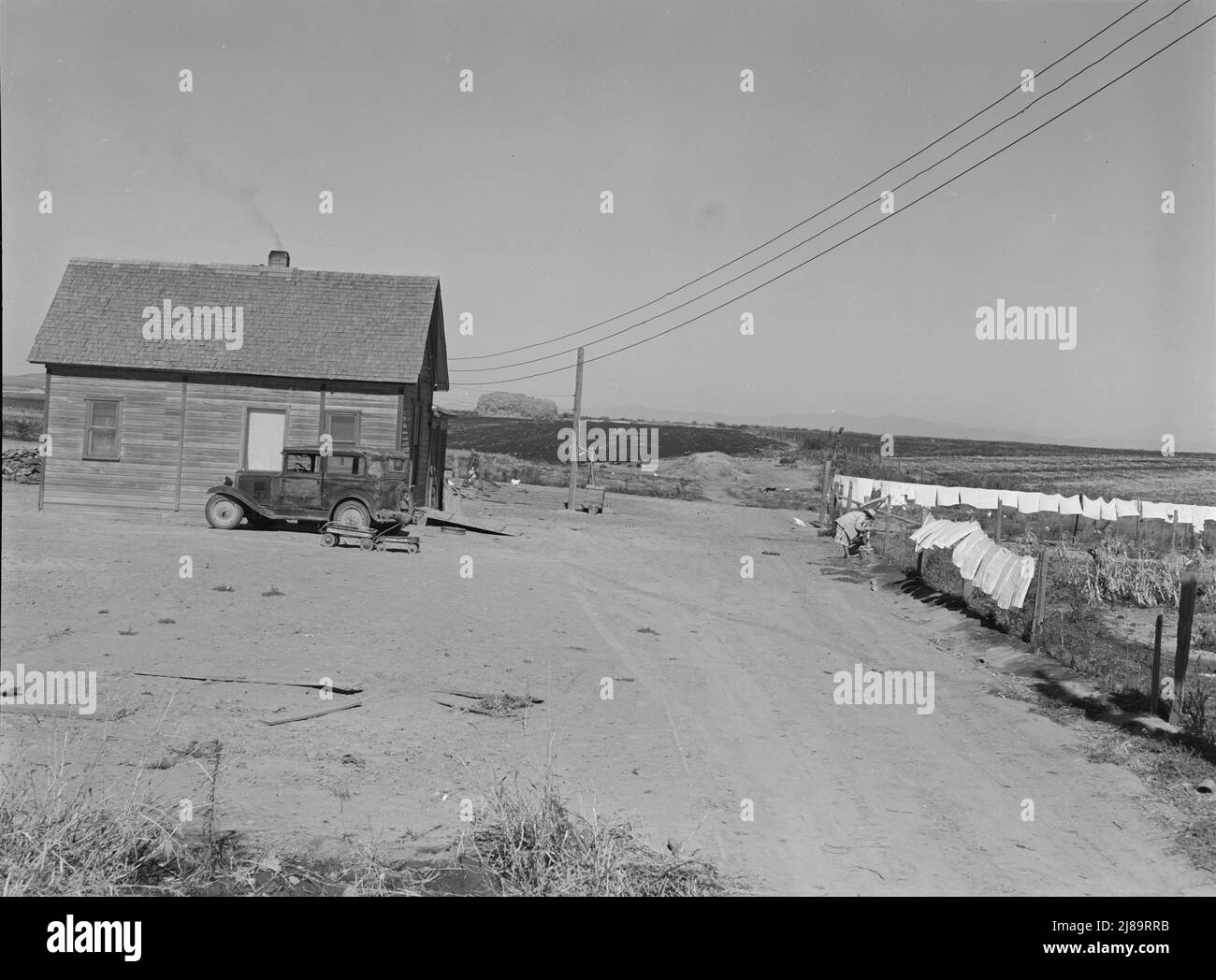 The Schroeder family's new house. Cleared and irrigated fields of their ...