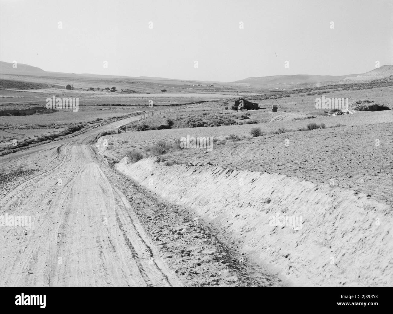 Entering Cow Hollow region in which practically all are FSA (Farm Security Administration) borrowers. These are farmers who had a late start. Malheur County, Oregon. Stock Photo