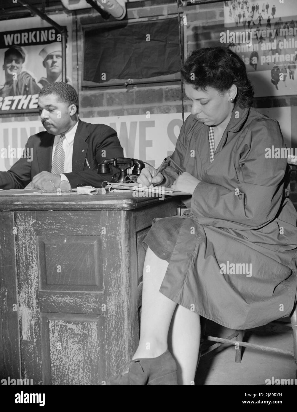 Washington, D.C. Air raid wardens' meeting in zone nine, Southwest area. Mr. Frederick Douglas, chairman, and Mrs. Hunton, secretary. Stock Photo