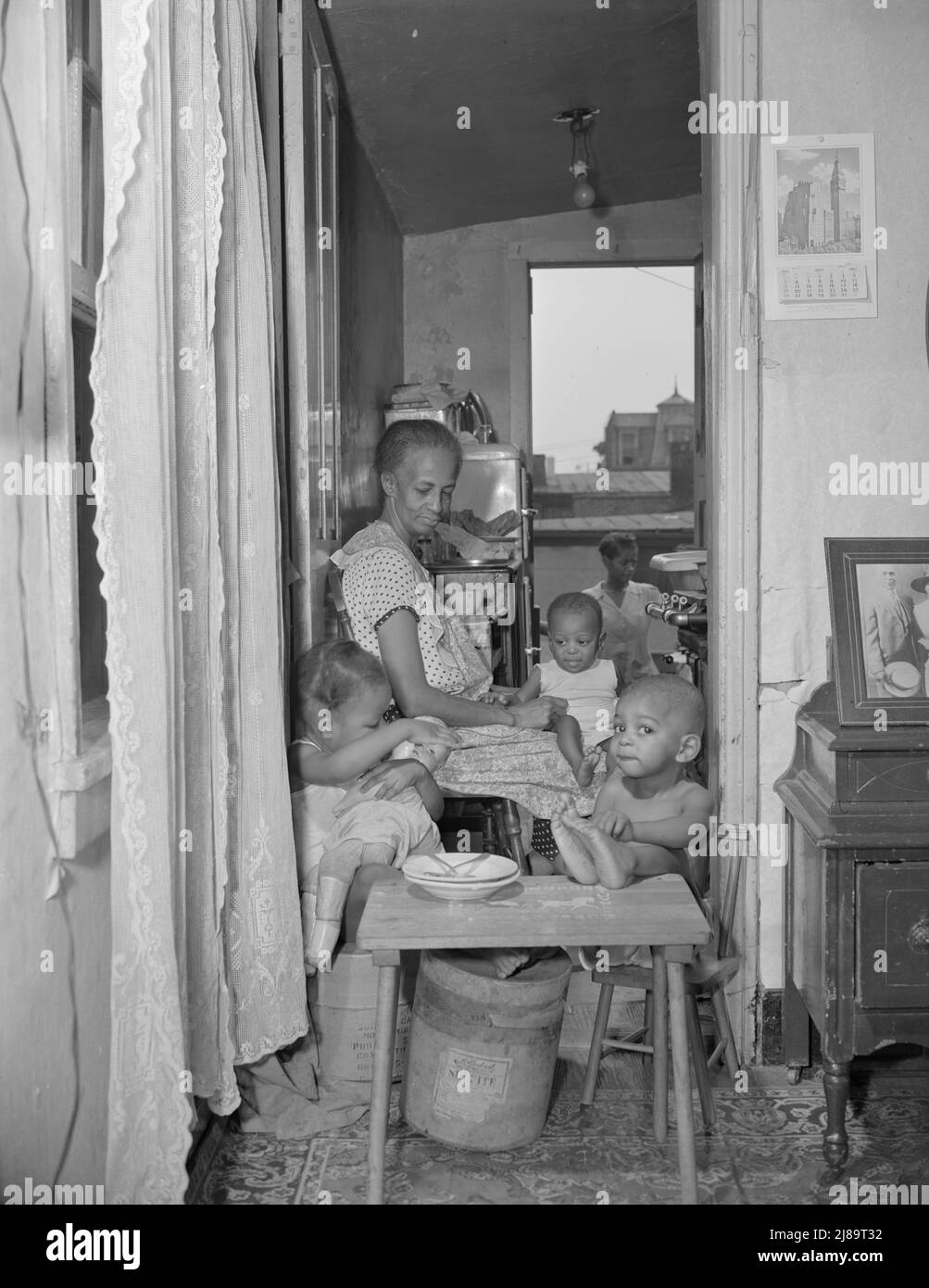 Washington, D.C. Mrs. Ella Watson, a government charwoman and her grandchildren. Stock Photo