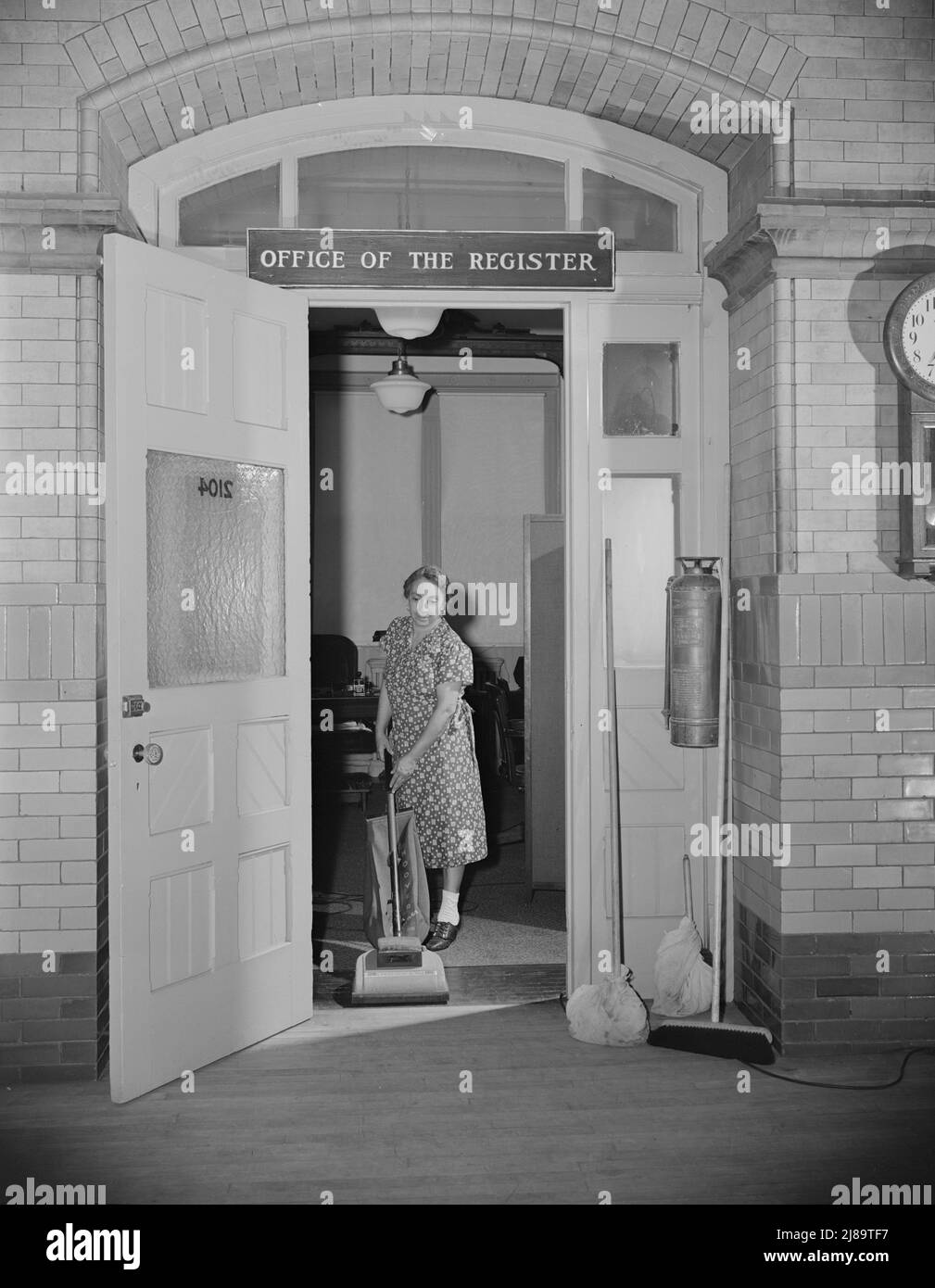 Washington, D.C. Charwoman cleaning after regular working hours at the