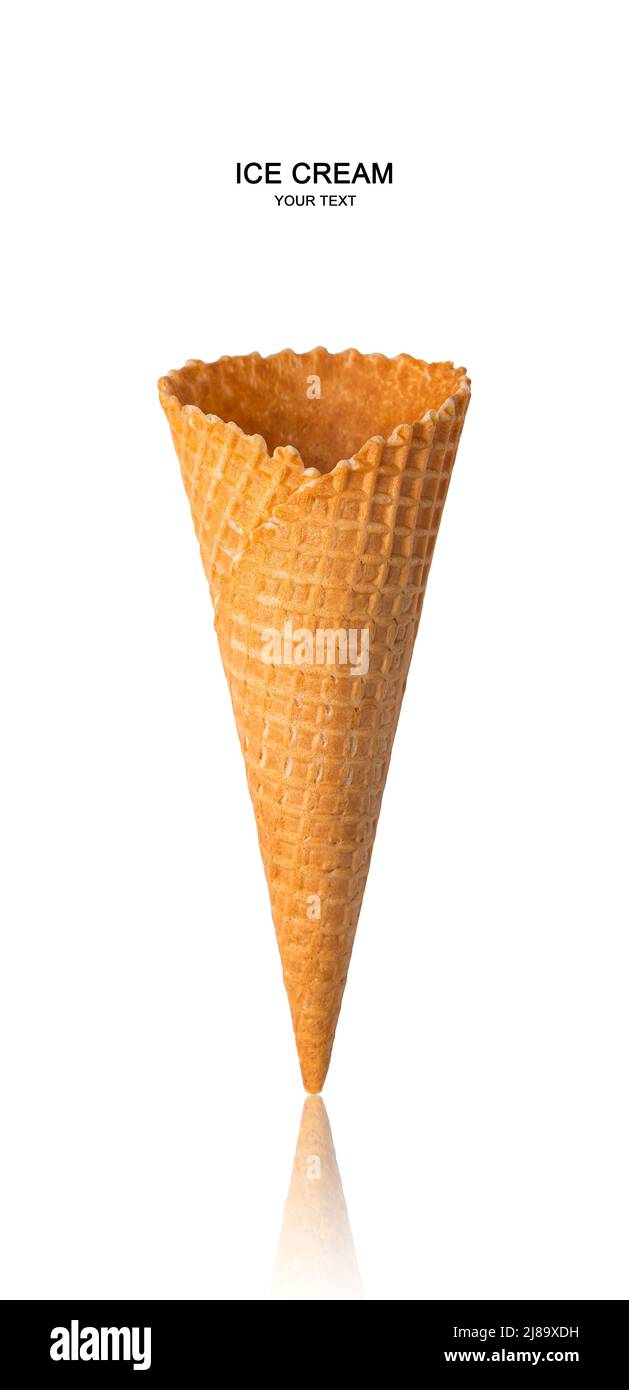 An empty waffle cone is isolated on a white background. Stock Photo