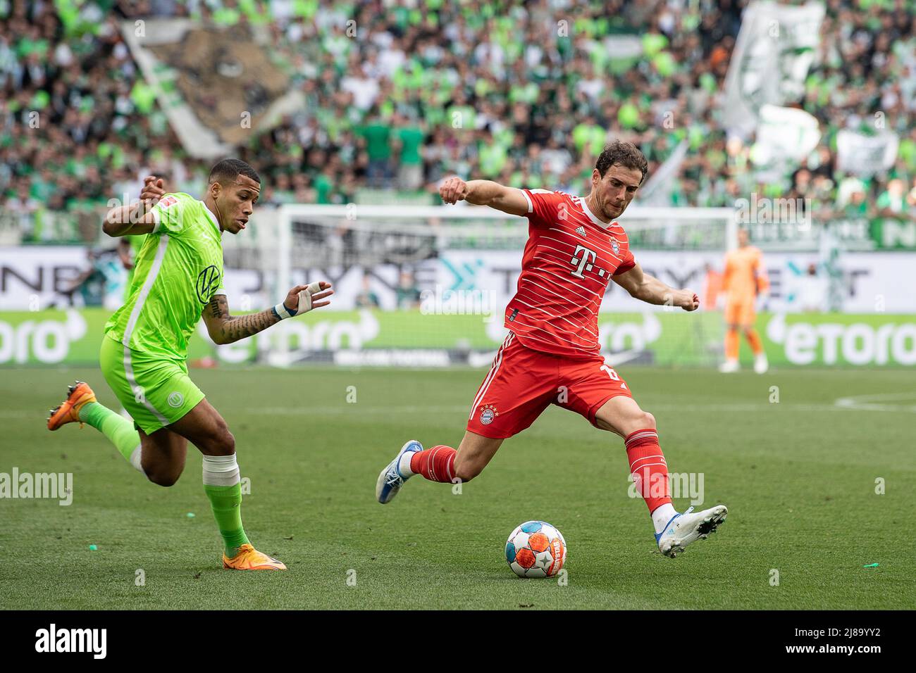 Wolfsburg, Germany. 14th May, 2022. Soccer: Bundesliga, VfL Wolfsburg - Bayern Munich, Matchday 34, Volkswagen Arena. Munich's Leon Goretzka (r) plays against Wolfsburg's Aster Vranckx. Credit: Swen Pförtner/dpa - IMPORTANT NOTE: In accordance with the requirements of the DFL Deutsche Fußball Liga and the DFB Deutscher Fußball-Bund, it is prohibited to use or have used photographs taken in the stadium and/or of the match in the form of sequence pictures and/or video-like photo series./dpa/Alamy Live News Stock Photo