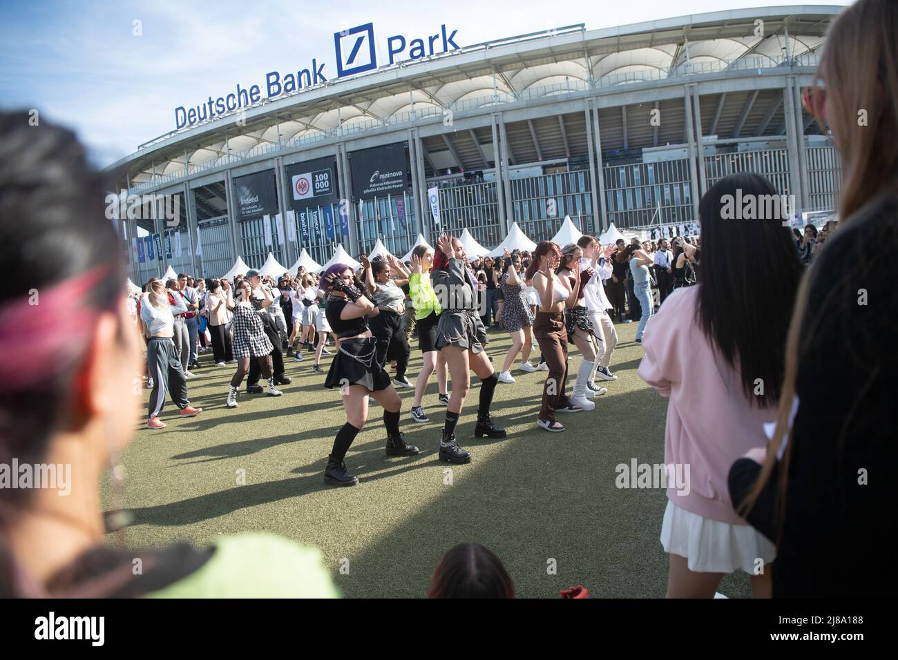 14 May 2022, Hessen, Frankfurt/Main Visitors dance during the KPop