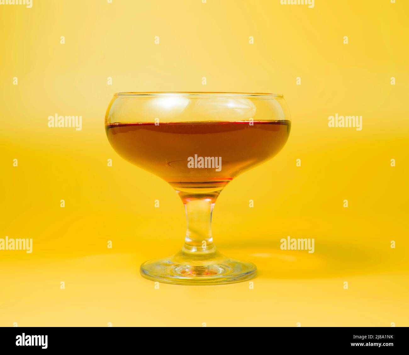 Orange liqueur cocktail on color background with copy space Stock Photo Orange liqueur cocktail on color background with copy space Stock Photo