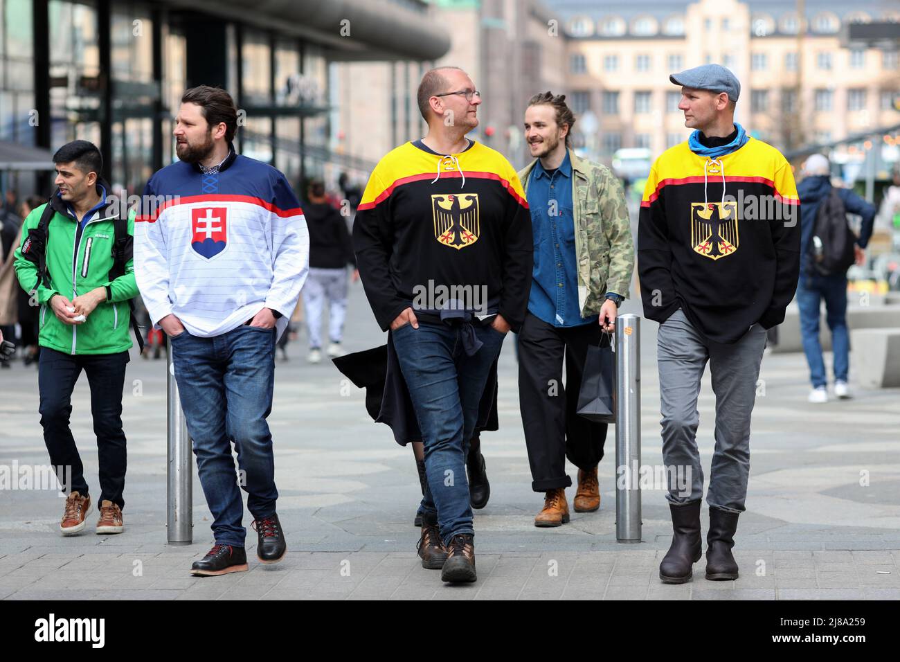 Fans of the German and Slovakian national ice hockey teams seen walking in Helsinki city center. On May 13, the Ice Hockey World Championship 2022 began in Finland. Hockey fans from many countries arrived in Helsinki and Tampere, the citys where the matches will take place. Stock Photo