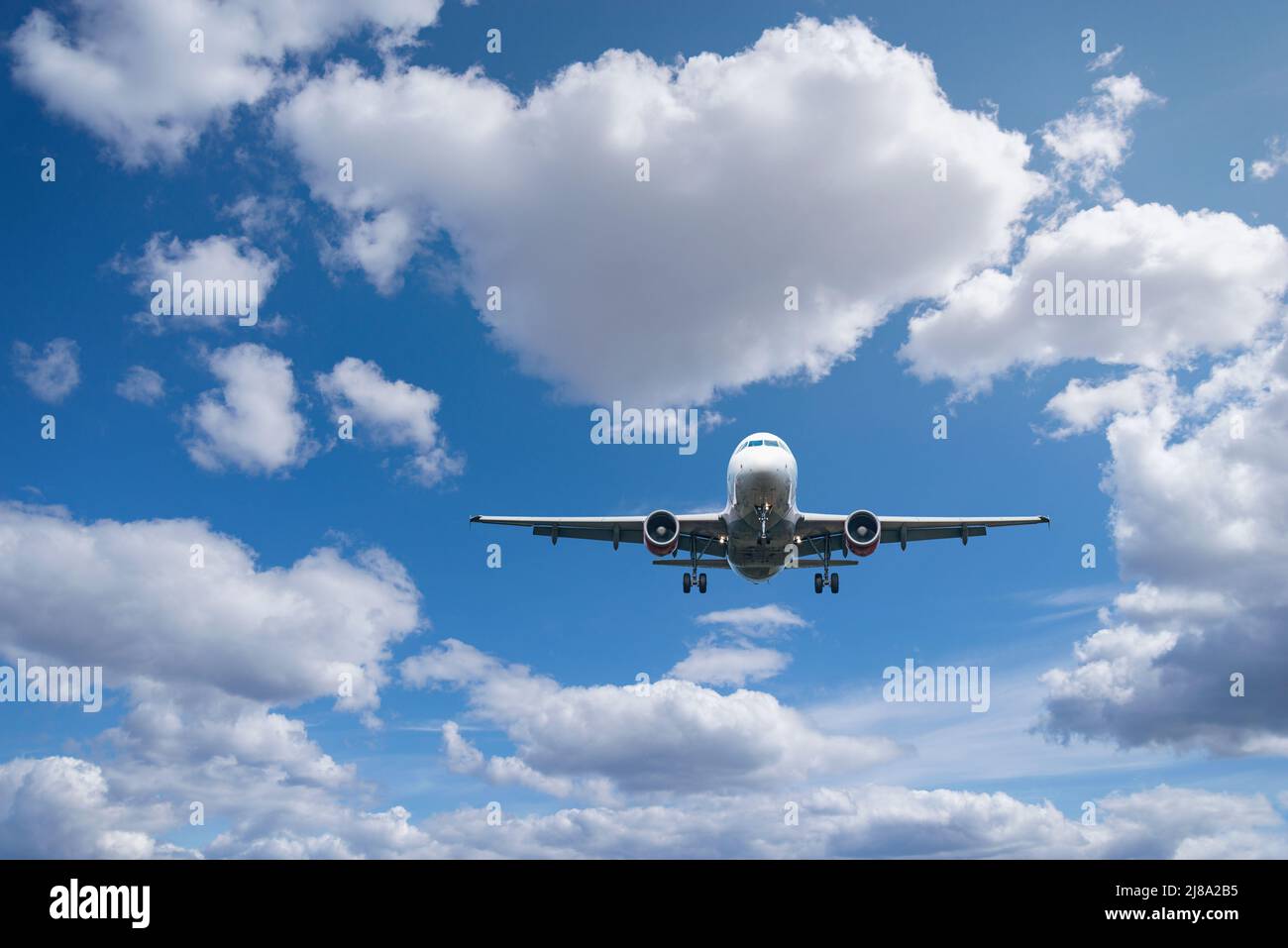 Flight of the passenger plane above the clouds Stock Photo - Alamy
