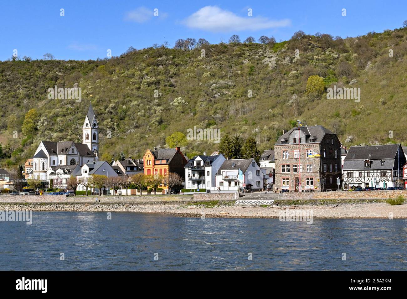 Kamp Bornhofen, Germany - April 2022: Waterfront buildings in Kamp Bornhofen which sits on the banks of the River Rhine Stock Photo