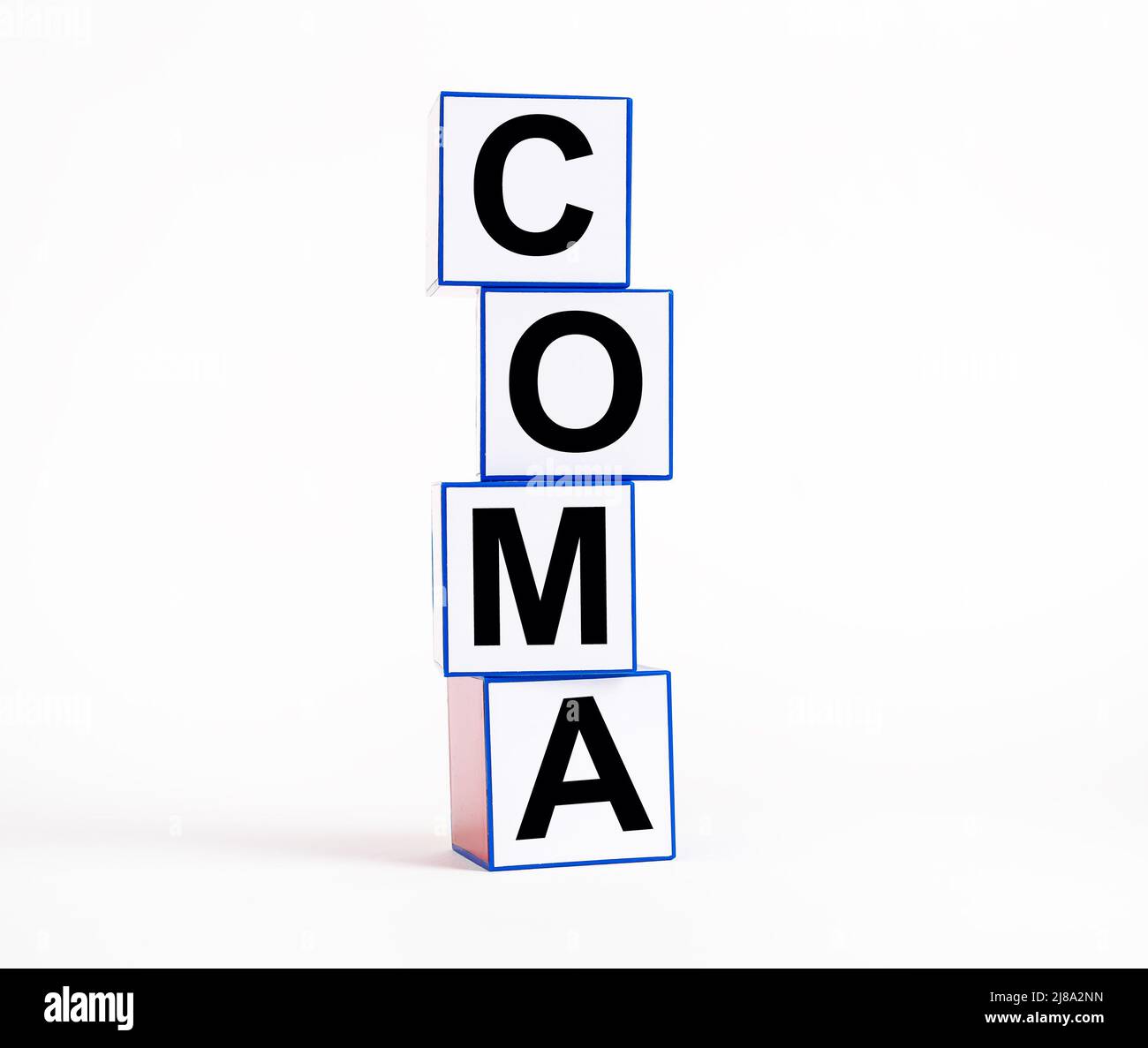 Coma word on medical cubes on white background. Stock Photo