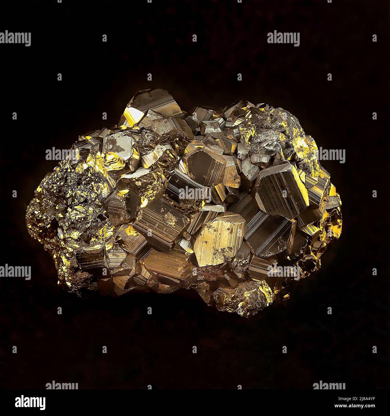 Pyrite Stone. Isolated. Golden natural raw stone in close up. Black background. Stock Image.b Stock Photo