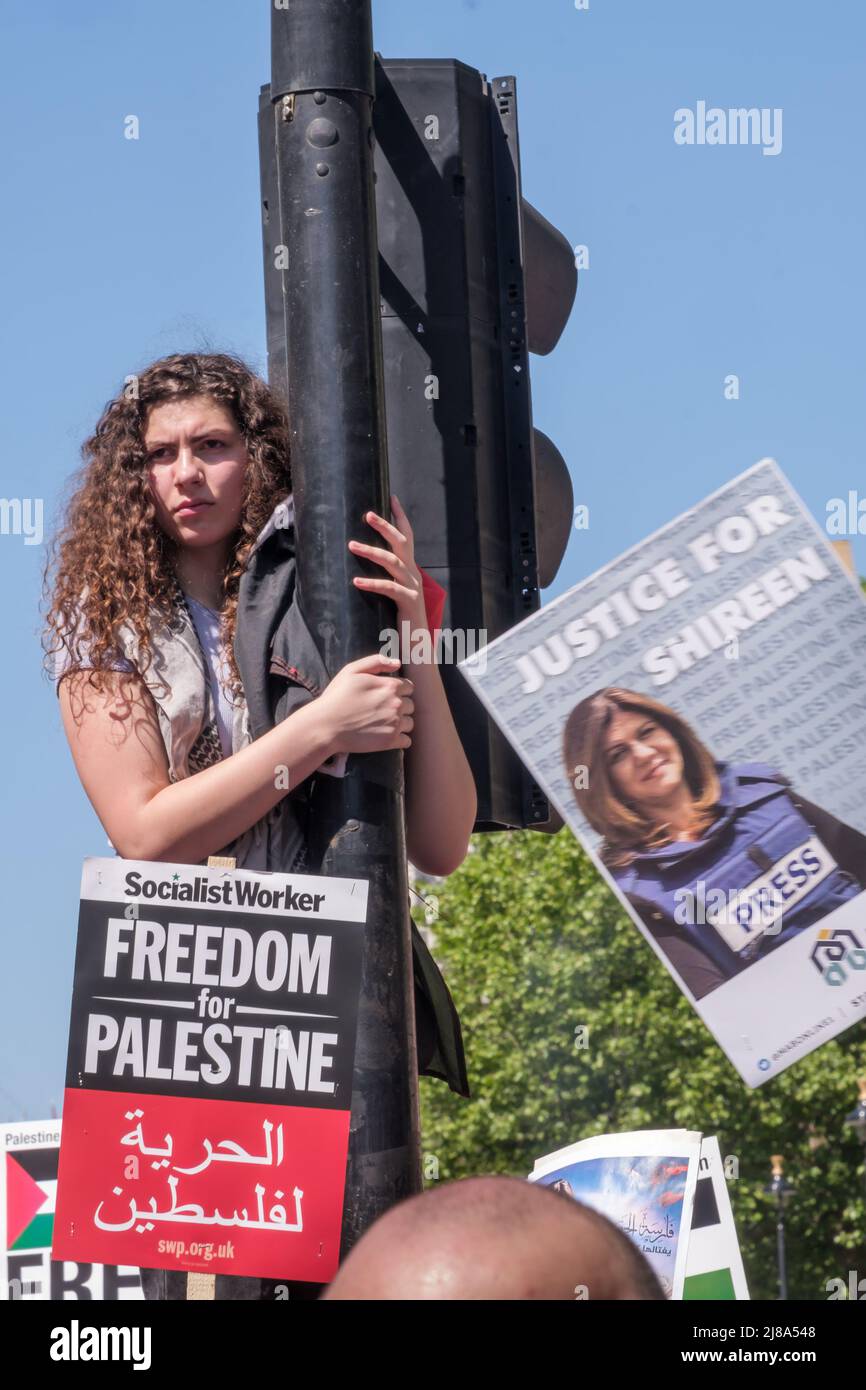 London, UK. 14 May 2022. People march from the BBC to a rally at Downing St against 74 years of Israel's increasing human rights abuse against Palestinians since over 750,000 were displaced from their homes by Zionist Israeli forces. The situation in Israel is now widely recognised internationally as apartheid. Marchers express shock at the attack on the pall-bearers at the funeral of journalist Shireen Abu Akleh, shot in cold blood by Israeli forces. Peter Marshall Alamy Live News Stock Photo