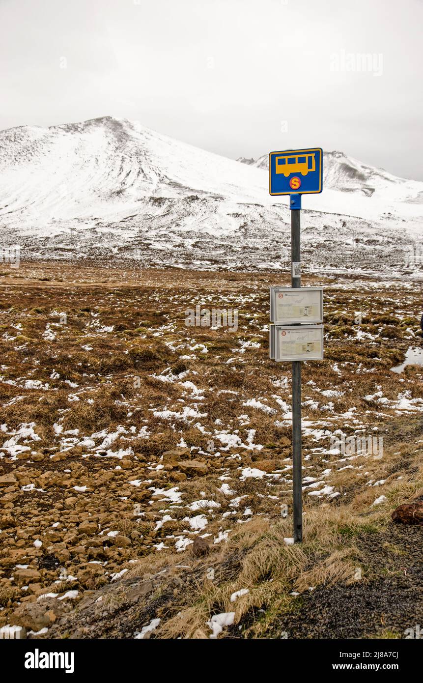 Stykkisholmur, Iceland, May 4, 2022: bus stop in a wild landscape with partly snow-covered mountains Stock Photo