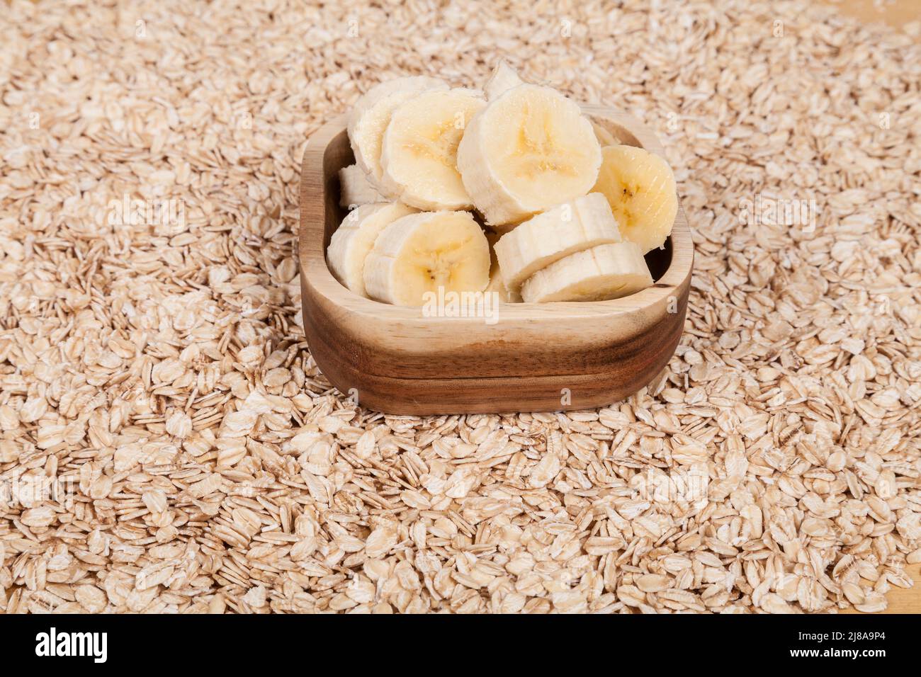 Healthy food healthy combination of oat flakes with ripe banana Stock