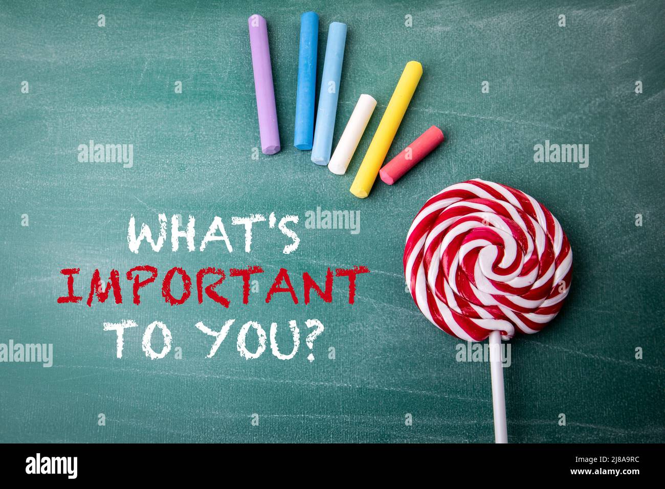 Whats important to you text on a green chalkboard stock photo alamy