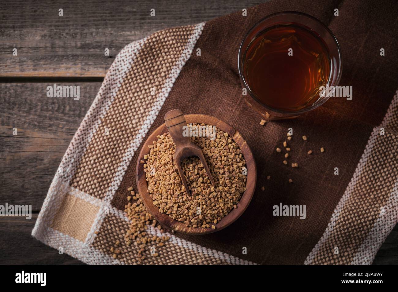 Egyptian fenugreek yellow tea or Methi Dana drink and fenugreek seeds Stock Photo