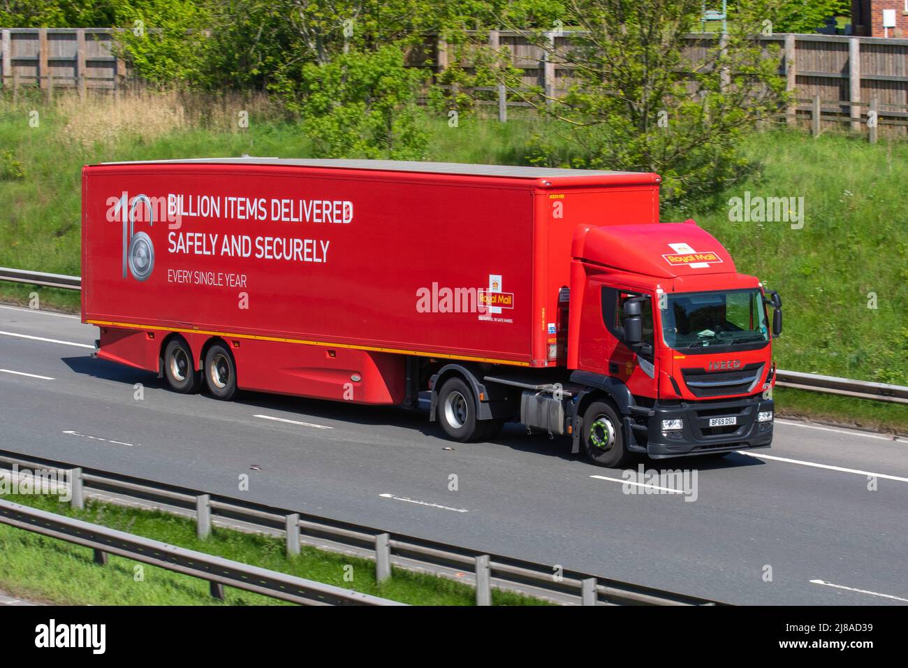 Royal Mail Haulage delivery trucks, lorry, transportation, truck, cargo carrier, DAF vehicle, European commercial transport, industry, M6 at Manchester, UK Stock Photo