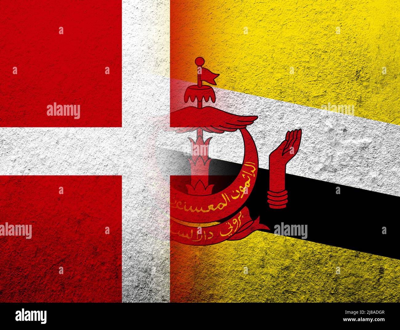 the Kingdom of Denmark National flag with the Nation of Brunei, the Abode of Peace National flag. Grunge Background Stock Photo