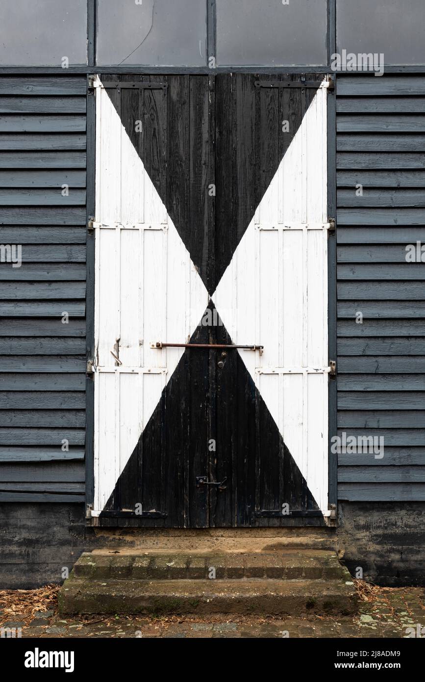 Mheer, Limburg, The Netherlands , 04 05 2022 - Wooden patterned barn doors Stock Photo