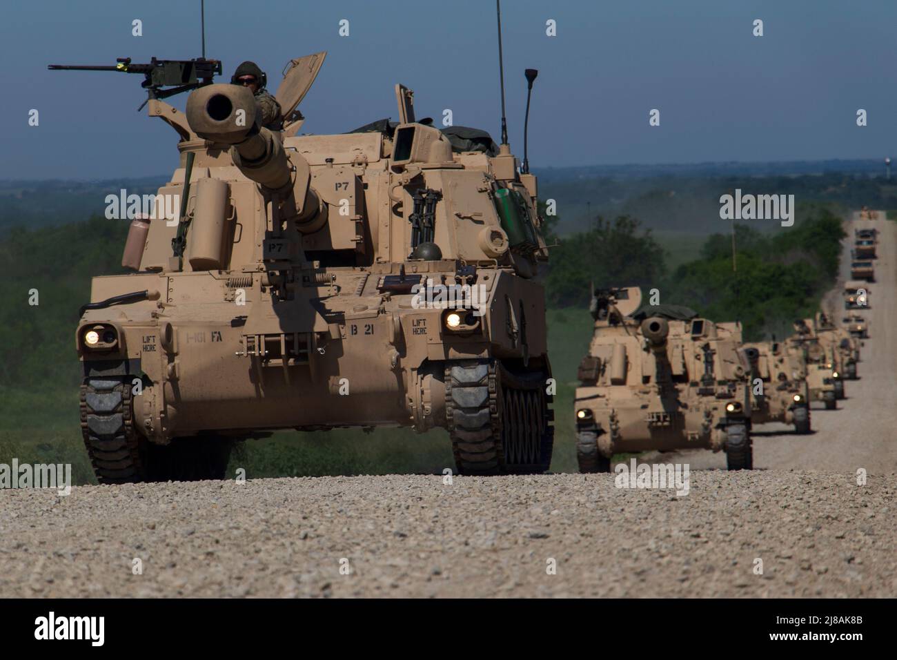 U.S. Army National Guard soldiers with the 1st Battalion, 214th Field Artillery Regiment, conduct a convoy of M109A7 Paladin self-propelled howitzer at Fort Riley, June 11, 2019 in Junction City, Kansas. Stock Photo