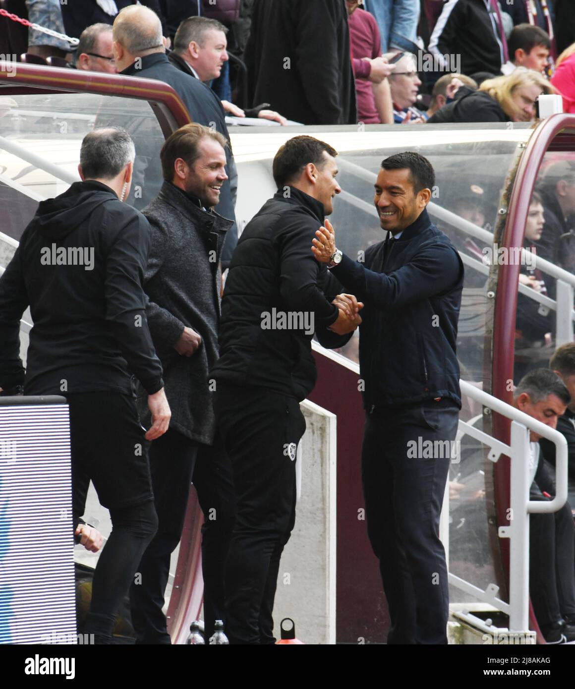 Tynecastle Park Edinburgh.Scotland UK .14th May 22. Hearts vs Rangers Cinch Premiership Match. Hearts' manager Robbie Neilson looks as coach Lee McCulloch receives birthday wishes from Rangers' manager, Giovanni van Bronckhorst Credit: eric mccowat/Alamy Live News Stock Photo
