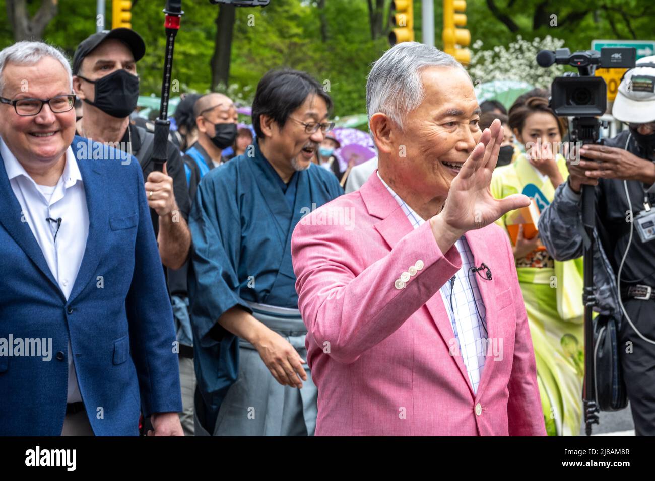 New York, USA. 14th May, 2022. Actor, activist and inaugural Grand Marshall George Takei wishes everybody 'Live Long and Prosper' as he walks ahead of husband Brad Altman (L) before participating in New York City's first Japan Day Parade. Credit: Enrique Shore/Alamy Live News Stock Photo