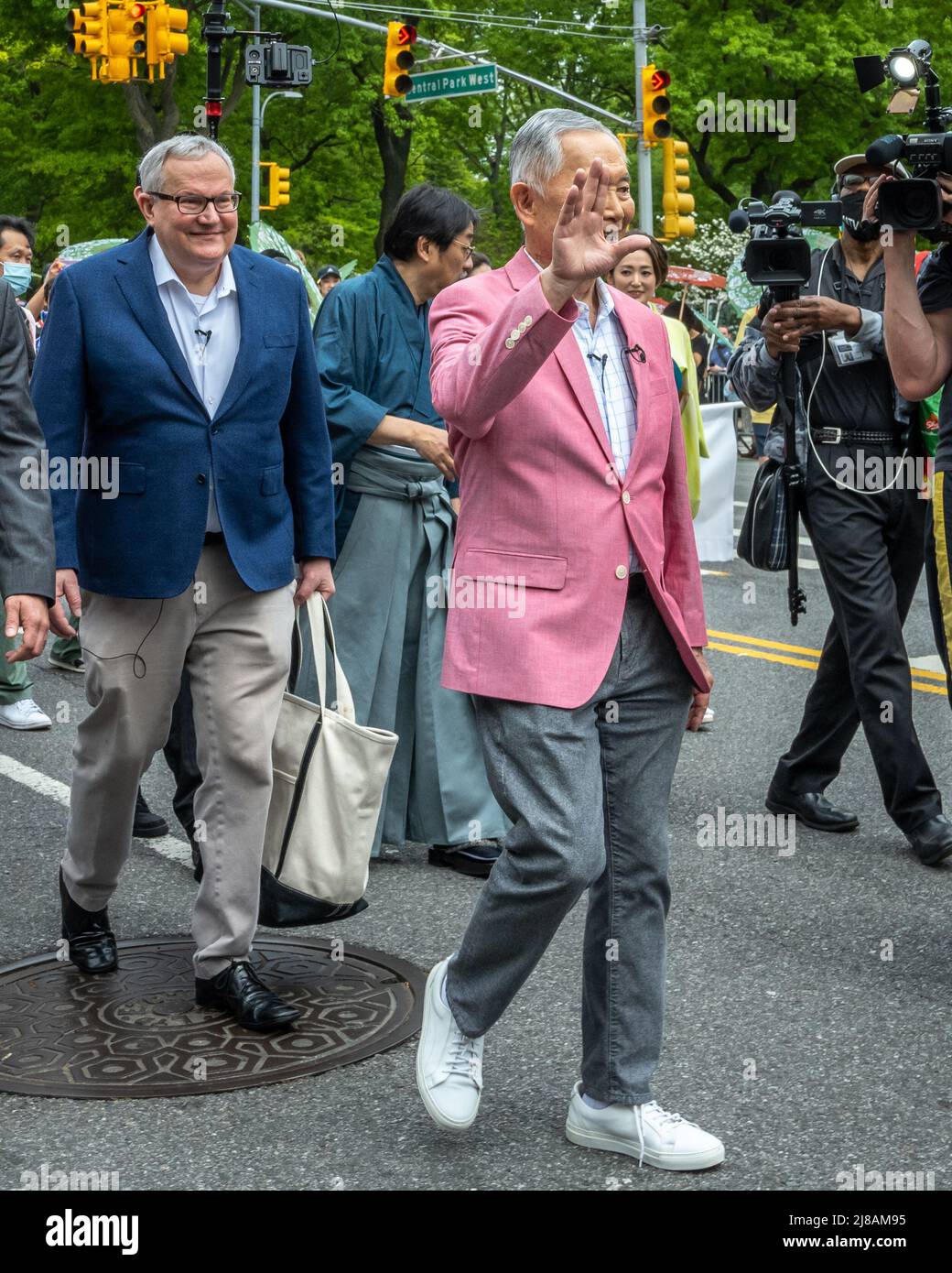 New York, USA. 14th May, 2022. Actor, activist and inaugural Grand Marshall George Takei wishes everybody 'Live Long and Prosper' as he walks ahead of husband Brad Altman (L) before participating in New York City's first Japan Day Parade. Credit: Enrique Shore/Alamy Live News Stock Photo