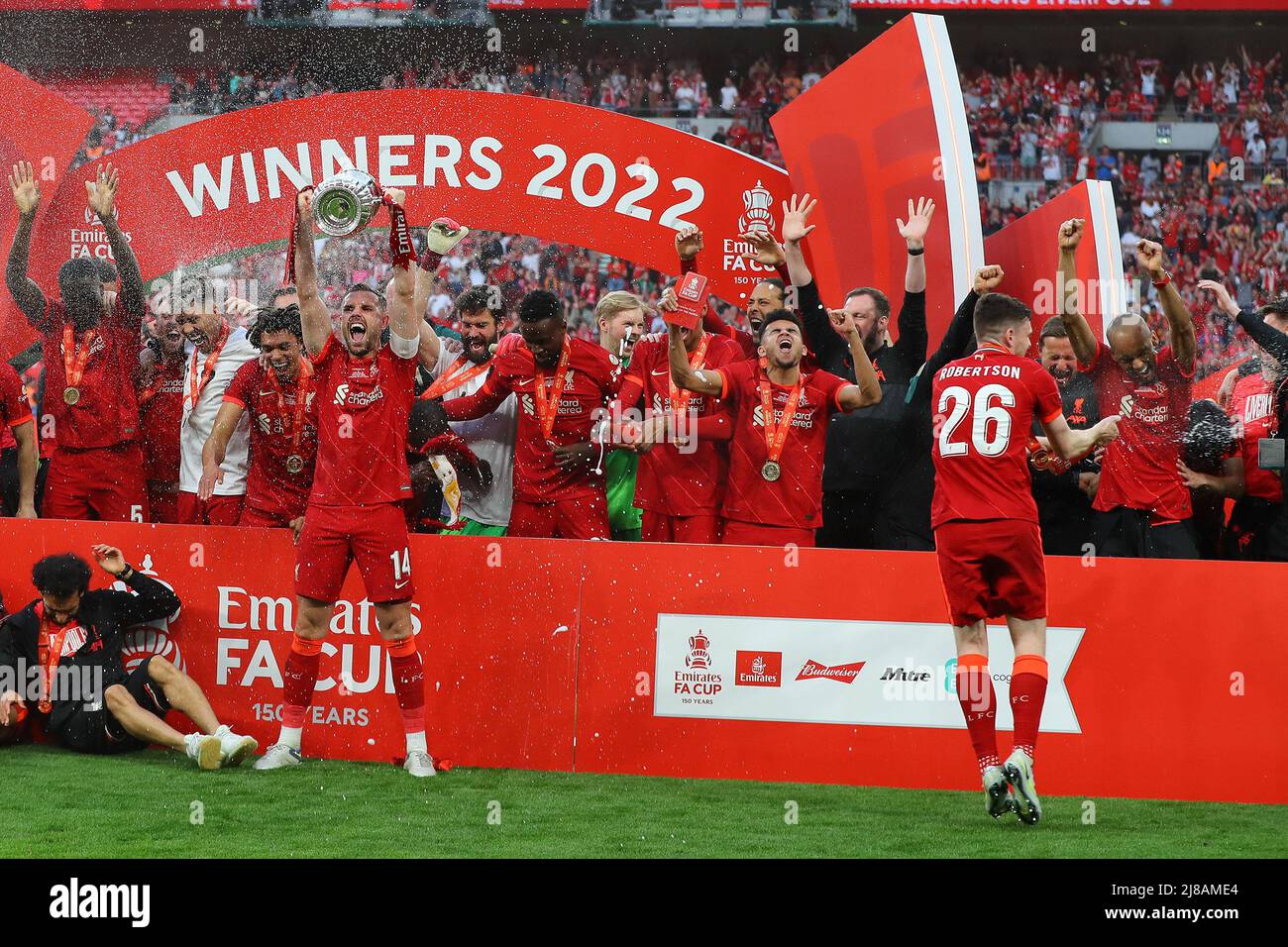 London, UK. 14th May, 2022. Liverpool FC players celebrate as Jordan Henderson of Liverpool lifts the FA Cup trophy. The Emirates FA Cup Final, Chelsea v Liverpool at Wembley Stadium in London on Saturday 14th May 2022.this image may only be used for Editorial purposes. Editorial use only, license required for commercial use. No use in betting, games or a single club/league/player publications.pic by Andrew Orchard/Andrew Orchard sports photography/Alamy Live News Credit: Andrew Orchard sports photography/Alamy Live News Stock Photo