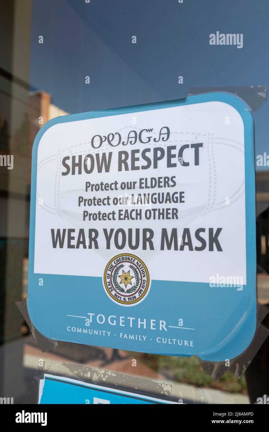 Tahlequah, Oklahoma - A notice produced by the Cherokee Nation asks people entering a building to show respect for others by wearing a mask during the Stock Photo