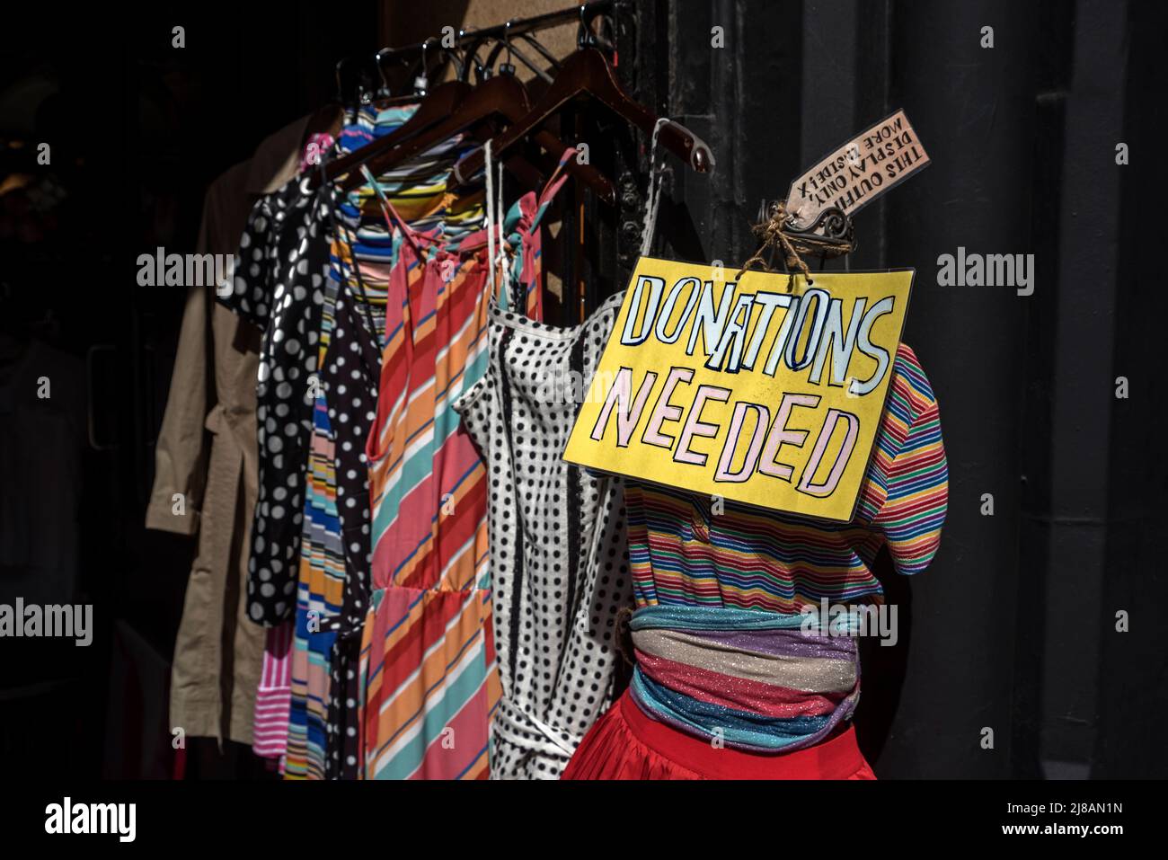 'Donatiions Needed' sign on a mannequin at a charity shop on Forrest Road, Edinburgh, Scotland, UK. Stock Photo
