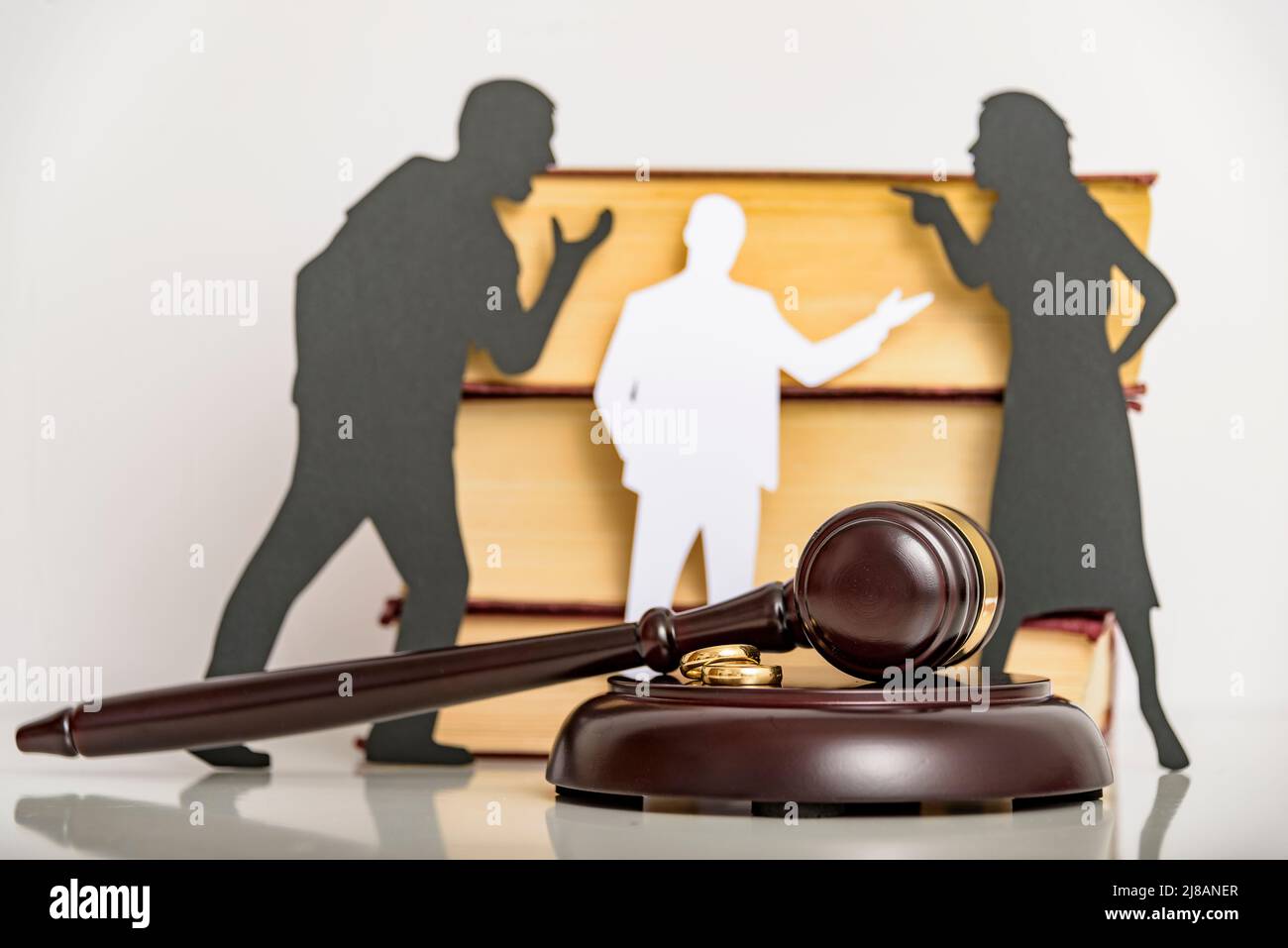 Silhouette symbol. Child custody. Family law proceedings. Divorce mediation, legal separation. Stock Photo