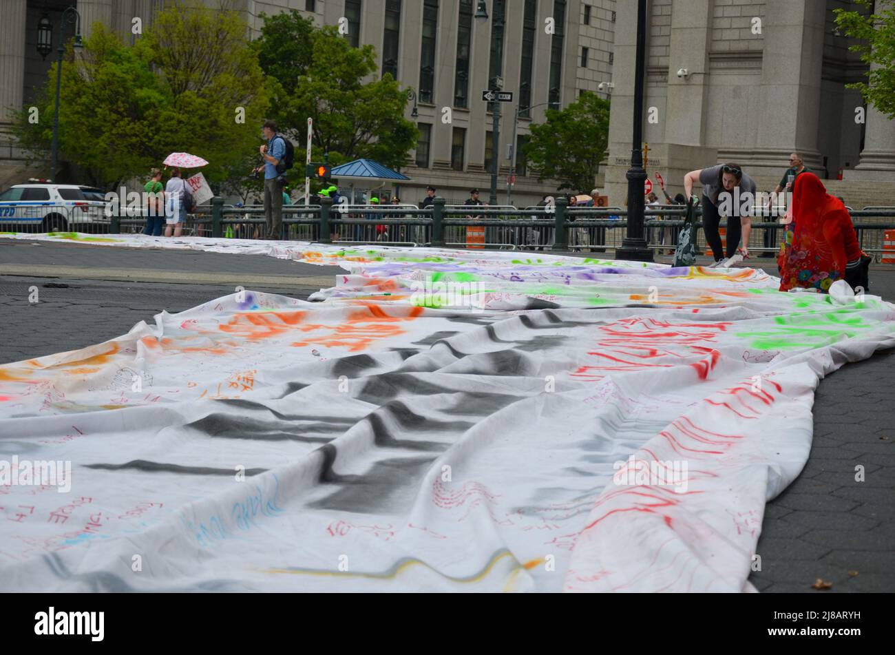 A giant banner has been drawn at Foley Square in New York City to demand reproductive rights for all women, on May 14, 2022. Stock Photo
