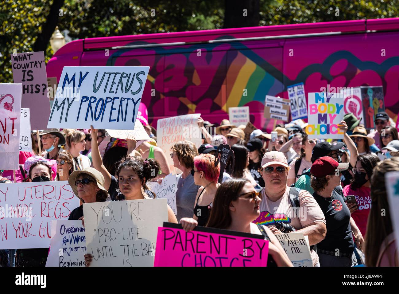 Photo of a 'My Uterus my Property' sign and group of protesters during the Roe Bans off our Bodies March and  Rally organized by Planned Parenthood. Stock Photo