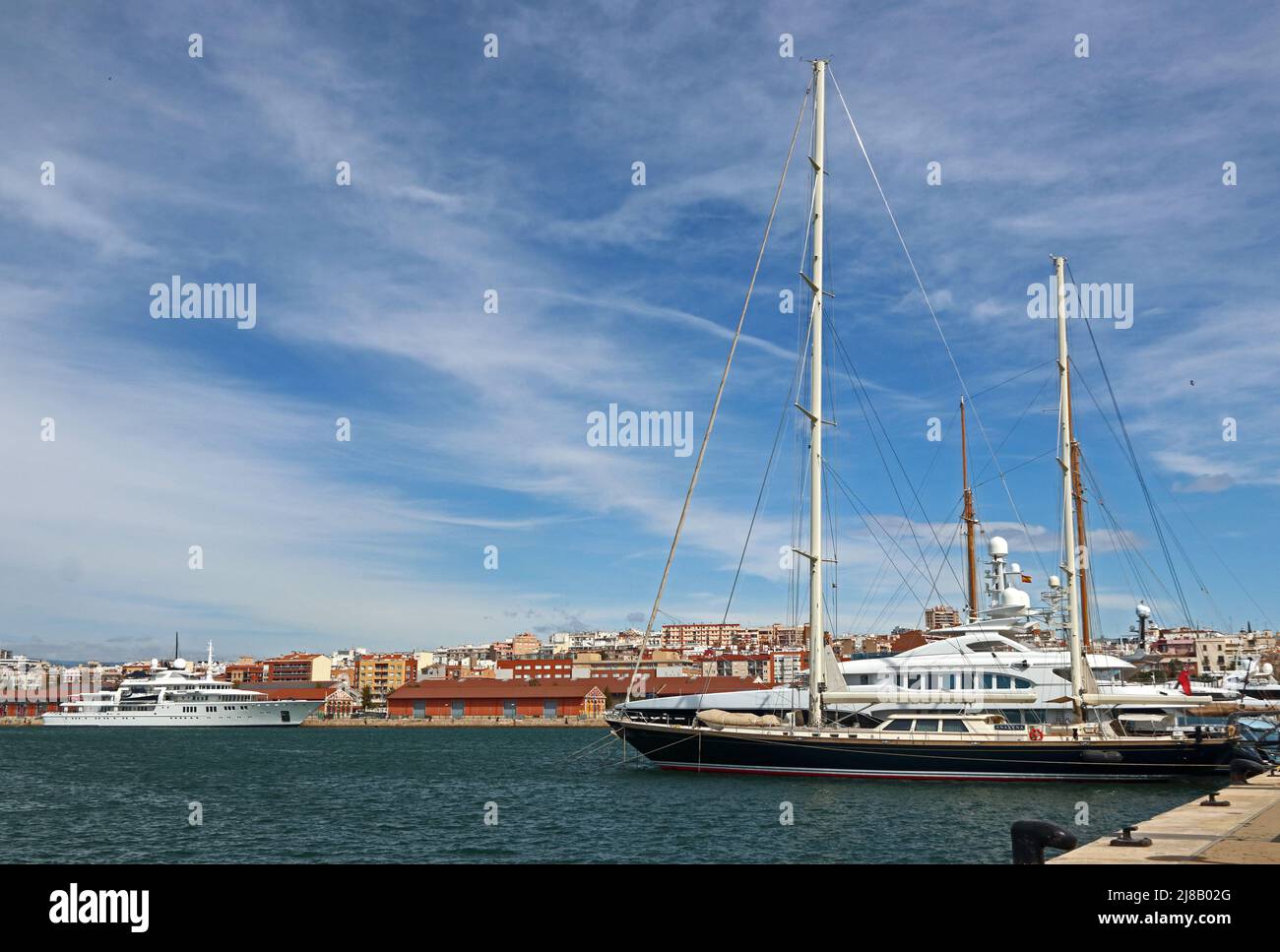 Superyachts moored in harbour, Tarragona Stock Photo