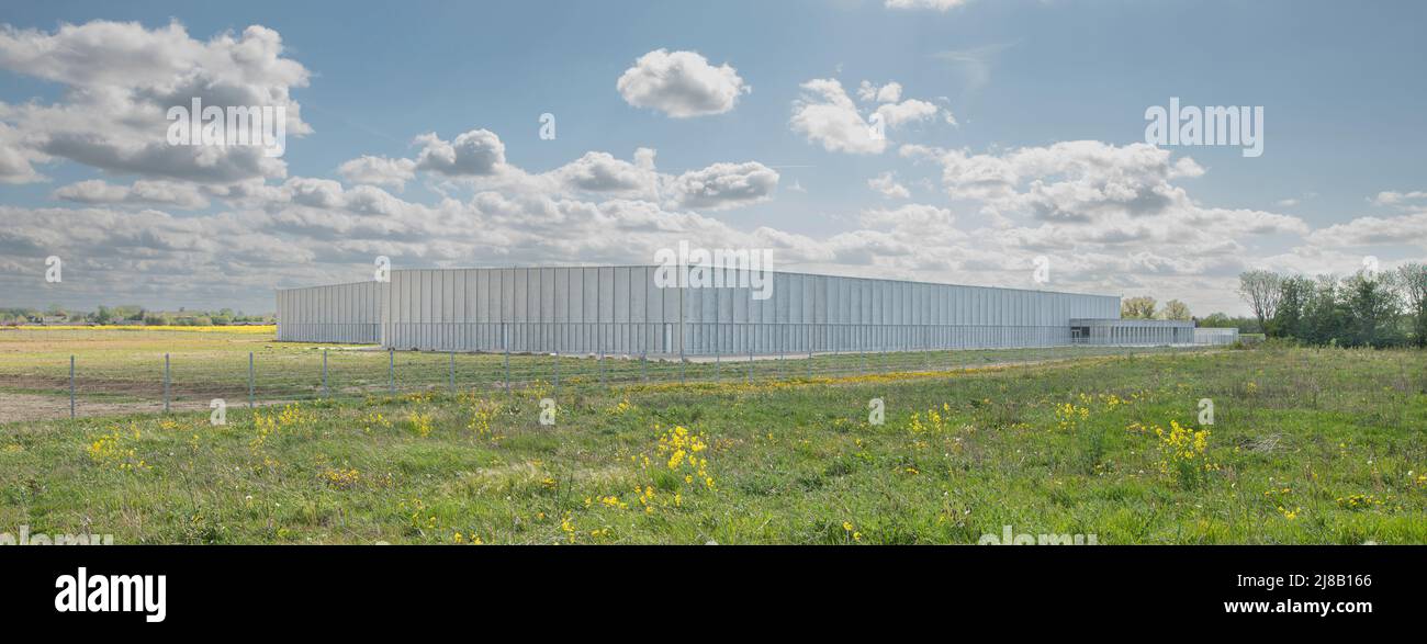 Storage building for the for the Royal Danish Library and National Museum in a green field at Vinge, Denmark, May 14, 2022 Stock Photo