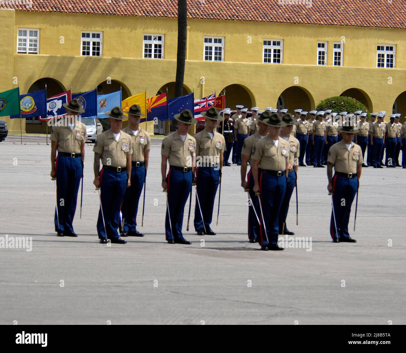 Drill Instructors stand at attention during a Recruit Graduation ceremony at Marine Corps