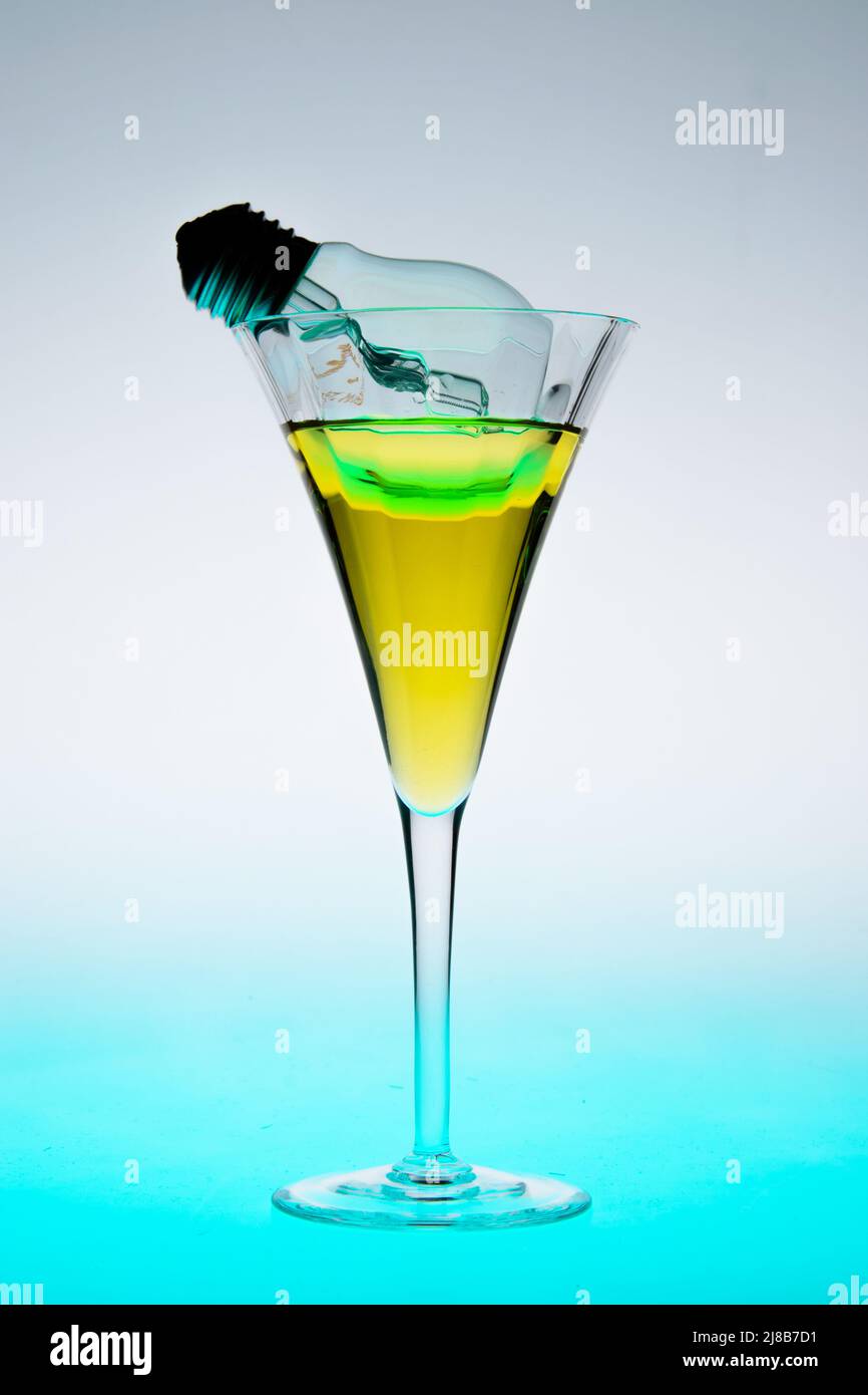 Lightning bolt in a glass with liquid. Stock Photo