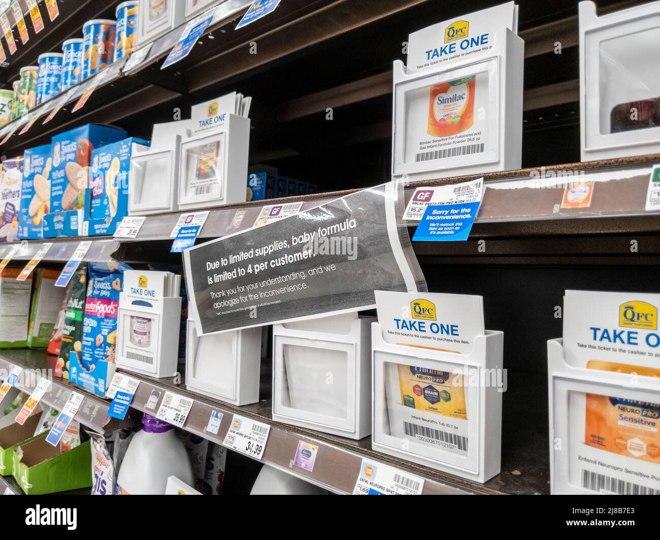 Lynnwood, WA USA - circa May 2022: Angled view of bare shelves during a baby formula shortage inside a QFC grocery store. Stock Photo