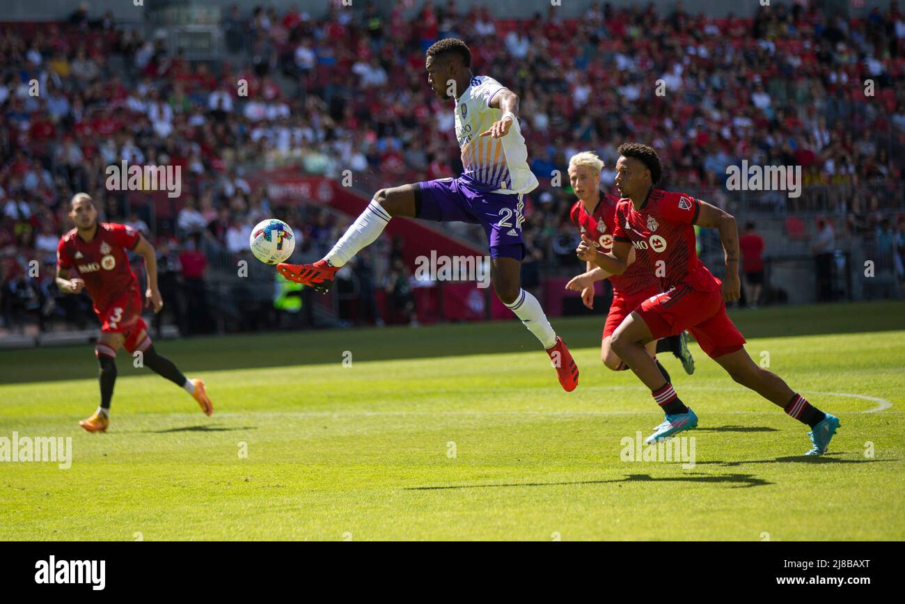 Toronto, Canada. 14th May, 2022. Andres Perea (2nd L) of Orlando City SC competes during the 2022 Major League Soccer (MLS) match between Toronto FC and Orlando City SC at BMO Field in Toronto, Canada, on May 14, 2022. Credit: Zou Zheng/Xinhua/Alamy Live News Stock Photo